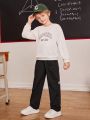 SHEIN Kids EVRYDAY Boys Letter Patched Flap Pocket Side Drawstring Waist Cargo Pants