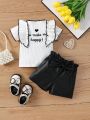 SHEIN Baby Girl Set Of 2, Including White Embroidered T-Shirt With Ruffle Hem And Reflective Fabric Shorts With Bow Tie At The Waist