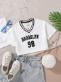 SHEIN Kids EVRYDAY Girls Letter Graphic Striped Trim Crop Tee