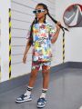 SHEIN Kids Cooltwn Teenage Girls' Fashionable Sporty Graffiti Printed Short Sleeve T-Shirt And Shorts Set With Round Neck