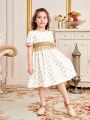 SHEIN Kids Nujoom Little Girls' Gold Foil Print Woven Tape Trim Patchwork Tassel Decoration Dress