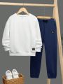 SHEIN Tween Boys' Casual Loose Fit Round Neck Top With Badge And Solid Color Pants Set