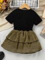 SHEIN Kids FANZEY Toddler Girls' Letter Printed Short Sleeve T-Shirt And Double-Layered Ruffle Hem Glitter Skirt 2pcs/Set