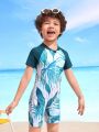 Young Boy's Random Tropical Printed Color Block Short Sleeve Swimsuit With Padded Shoulders And Shorts
