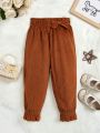 SHEIN Kids QTFun Little Girls' Flared Corduroy Pants With Ruffle Hem And Bowknot Detail