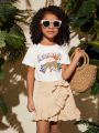 SHEIN Kids Cooltwn Young Girl Round Neck Short Sleeve T-Shirt And Ruffled Hem Skirt Suit