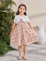 SHEIN Kids SUNSHNE Young Girls' Round Neck Short Sleeve Top With Ruffle Trim And Spaghetti Strap Floral Dress Set