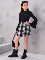 SHEIN Kids FANZEY Tween Girls' Knitted Solid Color Stand Collar Top And Knitted Plaid Skirt Set