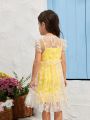 SHEIN Kids QTFun Young Girl Two Pieces Set Of Solid Color Spaghetti Strap Dress And Daisy Print Mesh Dress With Flying Sleeves