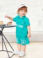 SHEIN Baby Boy Casual Outdoor Letter Pattern Short Sleeve Polo Shirt And Shorts Set