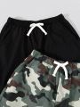 SHEIN Kids EVRYDAY Tween Boys' Loose Fit Casual Woven Camo & Solid Color Shorts 2pcs/set