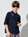 SHEIN Boys' Casual Lapel Super Loose Woven Open Placket Solid Color Short-sleeved Shirt