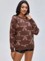 CreativeWingy Bow Pattern Drop Shoulder Sweater