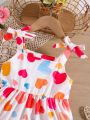 SHEIN Kids SUNSHNE Toddler Girls Heart Print Bow Shoulder Ruffle Hem Cami Dress