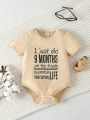 Infant Bodysuit With Slogan Print And Button Closure At Crotch