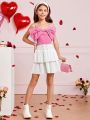 SHEIN Kids CHARMNG Tween Girls' Woven Solid Color Spaghetti Strap Top With Bowknot Detail And Woven Layered Skirt Set