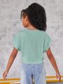 SHEIN Kids EVRYDAY Tween Girls' Knit Round Neck Solid Color Cropped Casual Short Sleeve T-Shirt