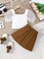 SHEIN Kids FANZEY Girls' Square Neck Spliced Mesh Puff Sleeves Decorative Button T-Shirt And Belt Skirt Two-Piece Set