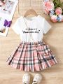 SHEIN Kids EVRYDAY Young Girl Knitted Letter Print Round Neck T-Shirt & Loose Fit Plaid Skirt Set