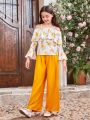 SHEIN Kids FANZEY Tween Girls' Hollow-Out Shoulder Ruffle Trim Floral Top And Detachable Belted Pants Two Piece Set