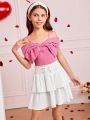 SHEIN Kids CHARMNG Tween Girls' Woven Solid Color Spaghetti Strap Top With Bowknot Detail And Woven Layered Skirt Set