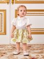 SHEIN Baby Girl Elegant Satin Bubble Short Sleeve Shirt With Floral Print Skirt Set