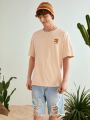 Manfinity VCAY Loose Fit Men's Knitted Short Sleeve Casual T-Shirt With Seaside Print On The Back