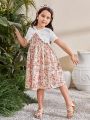 SHEIN Kids SUNSHNE Young Girls' Round Neck Short Sleeve Top With Ruffle Trim And Spaghetti Strap Floral Dress Set