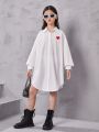 SHEIN Girls' Loose Fit Longline Shirt: Sweet, Cool, And Irregular; Heart Printed Shirt Dress
