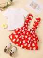 SHEIN Kids EVRYDAY Toddler Girls' Cute Sweetheart Heart Print T-Shirt And Ruffle Hem Suspender Skirt With Decorative Edging, Casual Style