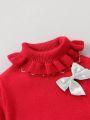 Baby's Turtleneck Sweater With Bow Detail