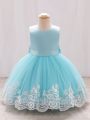 Young Girl's Sleeveless Embroidered Mesh Formal Dress With Large Bow Detail On Back