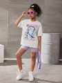 SHEIN Kids Y2Kool Girls Slogan & Figure Graphic Drop Shoulder Tee