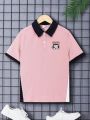 SHEIN Kids EVRYDAY Boys' Loose Fit Casual Color Block Polo Shirt With Turn-Down Collar And Letters Patch, Short Sleeve