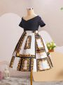 SHEIN Kids FANZEY Big Girls' Cross One Shoulder Short Sleeve T-Shirt With Baroque Print & Pleated Skirt Set