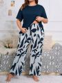 Plus Size Women's Solid Color T-shirt And Graphic Printed Trousers Loungewear Pajama Set