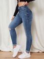 Women's Skinny Ripped Jeans With Water Washing Effect