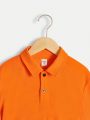 SHEIN Kids EVRYDAY Tween Boy Casual Loose Knitted Polo Shirt With Color-Blocking Placket, Sleeve Cuffs And Collar