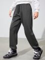 SHEIN Teen Boy Drawstring Waist Slant Pocket Solid Sweatpants