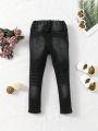 Young Girl Ripped Frayed Bleach Wash Jeans