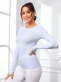 SHEIN Daily&Casual Solid Color Thumb Hole Slim Fit Sports T-Shirt With Round Neckline