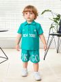 SHEIN Baby Boy Casual Outdoor Letter Pattern Short Sleeve Polo Shirt And Shorts Set