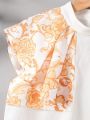 SHEIN Kids FANZEY Girls' Stand Collar Asymmetrically Spliced Flower Pattern Ruffle Sleeve Shirt