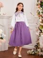 SHEIN Kids CHARMNG Teenage Girls' Mandarin Collar Flower Pattern Lantern Sleeve Shirt And Button Decorated Skirt Two Piece Set