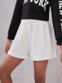 SHEIN Kids Cooltwn Girls' Street Trendy Sports Knitted Solid Color Loose Shorts