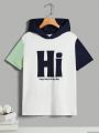 SHEIN Kids SPRTY Boys' Loose Fit Sports Hooded Short Sleeve T-Shirt With Letter Patchwork And Color Collision