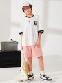 SHEIN Kids KDOMO Boys' Casual Loose Fit Knit Tee With Color Block And Printed Pattern, Round Neck Pullover