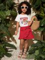SHEIN Kids Cooltwn Young Girl Pattern Printed Short Sleeve T-Shirt With Ruffled Wrap Mini Skirt Set