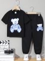 SHEIN Toddler Boys' Casual Comfortable Skull & Bear Printed Short Sleeve Top With Knitted Long Pants Set