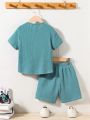 SHEIN Kids EVRYDAY Young Boys' Loose Casual Solid Color Short Sleeve T-Shirt And Shorts 2pcs Set